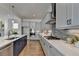 Stylish kitchen featuring granite countertops, stainless steel appliances, and ample cabinet space at 717 Farmstead Rd, Suwanee, GA 30024