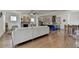 Spacious living area connecting to a modern kitchen with an island and stylish finishes at 717 Farmstead Rd, Suwanee, GA 30024