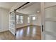 Bright and airy living room with wood floors, sliding doors and multiple windows allowing ample natural light at 717 Farmstead Rd, Suwanee, GA 30024