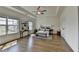 Bright main bedroom features hardwood floors, tray ceilings, large windows and neutral décor at 717 Farmstead Rd, Suwanee, GA 30024