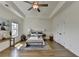 Comfortable main bedroom has hardwood floors, tray ceilings and is bathed in natural light at 717 Farmstead Rd, Suwanee, GA 30024