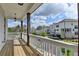 Comfortable porch overlooking neighborhood with houses and yards at 717 Farmstead Rd, Suwanee, GA 30024