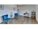 Bright sitting room with hardwood floors, comfortable blue chairs, and stylish decor at 717 Farmstead Rd, Suwanee, GA 30024