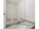 Bathroom features granite counters, a decorative mirror, and modern fixtures at 164 Edison Dr, Stockbridge, GA 30281