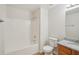 Clean bathroom with granite vanity, shower and tub combo, and modern fixtures at 164 Edison Dr, Stockbridge, GA 30281