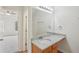 Bathroom featuring a sink with granite countertop, modern lighting and fixtures, and access to the bedroom at 164 Edison Dr, Stockbridge, GA 30281