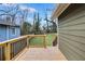 Wood deck overlooks a well-maintained backyard with green grass and privacy fencing at 2243 Newnan St, Atlanta, GA 30344