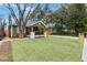 Beautifully landscaped home with a lush green lawn and a welcoming front porch at 2243 Newnan St, Atlanta, GA 30344