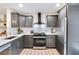 Bright kitchen featuring gray cabinets, stainless steel appliances, and modern finishes at 2243 Newnan St, Atlanta, GA 30344