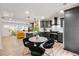 Open kitchen with gray cabinets, an island, stainless steel appliances, and breakfast area at 2243 Newnan St, Atlanta, GA 30344