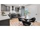 Modern kitchen features stainless steel appliances, herringbone backsplash, and eat-in breakfast nook at 2243 Newnan St, Atlanta, GA 30344