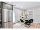 Kitchen with stainless steel refrigerator and eating area next to the pantry at 2243 Newnan St, Atlanta, GA 30344