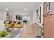 Modern living room with hardwood floors, kitchen access, and stylish furnishings at 2243 Newnan St, Atlanta, GA 30344