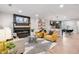 Open-concept living room with modern fireplace, kitchen view and sleek furniture at 2243 Newnan St, Atlanta, GA 30344