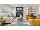 Cozy living room with a modern fireplace, built-in shelves, and comfortable seating at 2243 Newnan St, Atlanta, GA 30344