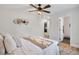 Comfortable primary bedroom boasts ceiling fan, decor, and en-suite bathroom with walk-in shower at 2243 Newnan St, Atlanta, GA 30344