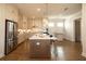 Open kitchen featuring a large island, stainless steel appliances, and ample cabinet space at 532 Pearl St, Cumming, GA 30040