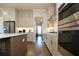 Modern kitchen with stainless steel appliances, a center island, and stylish cabinetry at 532 Pearl St, Cumming, GA 30040