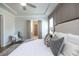 Serene primary bedroom featuring a tray ceiling and soft decor for a relaxing personal space at 532 Pearl St, Cumming, GA 30040