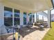 Covered patio with comfortable seating, a built-in grill, and access to the backyard at 532 Pearl St, Cumming, GA 30040