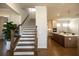 Beautiful staircase with hardwood steps and iron railing leading to the second floor and an open floor plan at 532 Pearl St, Cumming, GA 30040