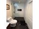 Modern bathroom shower with white tile and black pebble floor and corner niche at 860 Peachtree Ne St # 2212, Atlanta, GA 30308