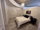 Cozy bedroom with a comfortable bed, neutral decor, and hardwood floors at 860 Peachtree Ne St # 2212, Atlanta, GA 30308