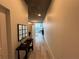 Hallway view with console table and mirror leading to a room with city views at 860 Peachtree Ne St # 2212, Atlanta, GA 30308