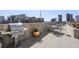 Rooftop outdoor grill and lounge area featuring modern seating and city views, perfect for entertaining at 860 Peachtree Ne St # 2212, Atlanta, GA 30308
