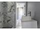 Bathroom featuring a modern vanity and a shower with large marble-patterned tile at 1831 Jonesboro Se Rd, Atlanta, GA 30315