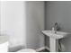 Bathroom sink and toilet with gray walls at 1831 Jonesboro Se Rd, Atlanta, GA 30315