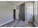 Bedroom featuring gray walls, vinyl plank flooring, with two paneled doors at 1831 Jonesboro Se Rd, Atlanta, GA 30315