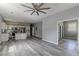 Open-concept living and kitchen area featuring gray walls, wood floors, and stainless steel appliances at 1831 Jonesboro Se Rd, Atlanta, GA 30315