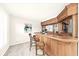 Home bar perfect for entertaining, featuring custom woodwork and ample storage at 5280 Oak Hill Ter, Cumming, GA 30040