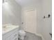 Bathroom featuring a sink, toilet, and closet at 5280 Oak Hill Ter, Cumming, GA 30040