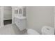 Bathroom featuring double mirrors, toilet, and sink at 5280 Oak Hill Ter, Cumming, GA 30040