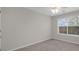 Bedroom with window view and neutral carpet at 5280 Oak Hill Ter, Cumming, GA 30040