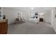 Spacious bedroom with tray ceiling, sitting area, white bedding, and large windows at 5280 Oak Hill Ter, Cumming, GA 30040