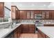 Kitchen with stainless steel appliances, a large window, and ample countertop space at 5280 Oak Hill Ter, Cumming, GA 30040
