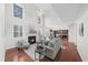 Bright living room with high ceilings, fireplace, and hardwood floors at 5280 Oak Hill Ter, Cumming, GA 30040