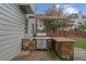 Outdoor kitchen and bar area, ideal for summer barbecues and gatherings at 5280 Oak Hill Ter, Cumming, GA 30040