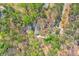 Aerial view of the home and surrounding property showing tree coverage and privacy at 730 Ponderosa Ct, Fayetteville, GA 30214
