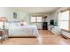 Bright bedroom features wood floors, a large bed and plenty of natural light at 730 Ponderosa Ct, Fayetteville, GA 30214