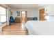 Light-filled bedroom featuring hardwood floors, a large bed, and ample natural light at 730 Ponderosa Ct, Fayetteville, GA 30214
