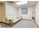 Cozy room with yellow futon, reading pillows, and natural light at 730 Ponderosa Ct, Fayetteville, GA 30214