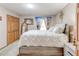 Bright bedroom with a neutral color palette, closet, large bed and carpeted floor at 730 Ponderosa Ct, Fayetteville, GA 30214