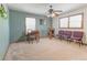 Bonus room with carpet, ceiling fan and natural light can serve as office or extra living space at 730 Ponderosa Ct, Fayetteville, GA 30214