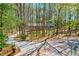 Secluded home surrounded by mature trees with a long driveway at 730 Ponderosa Ct, Fayetteville, GA 30214