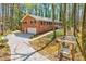 Brick home showcasing large yard, long driveway and carport at 730 Ponderosa Ct, Fayetteville, GA 30214