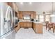 Bright kitchen with stainless steel appliances, light countertops, and a view to the breakfast nook at 730 Ponderosa Ct, Fayetteville, GA 30214